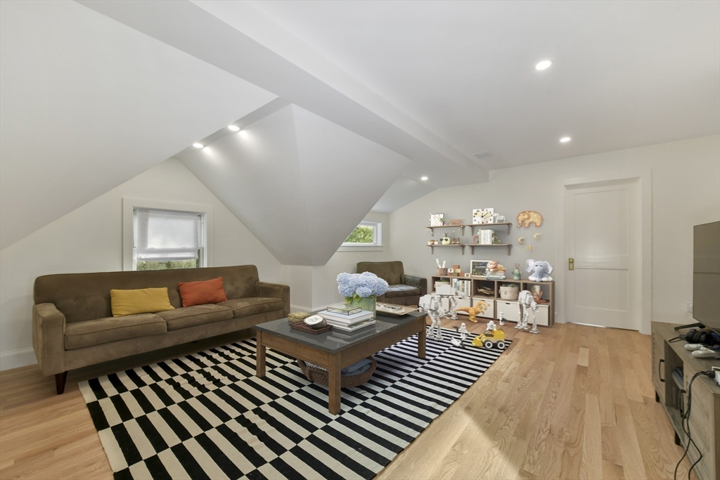 26 Bartlett Avenue Arlington, MA 02476 - Photo 24 of 27 a living room with furniture and a couch