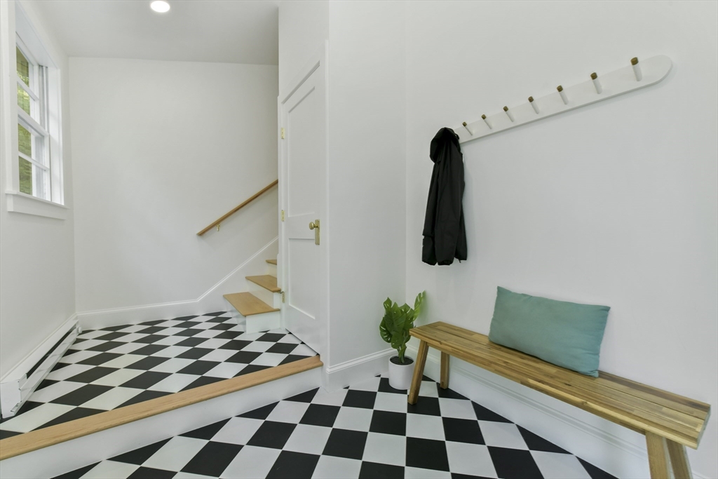 26 Bartlett Avenue Arlington, MA 02476 - Photo 25 of 27 a bedroom with a bed and a chair