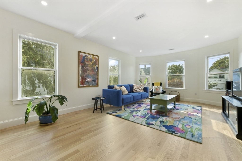 26 Bartlett Avenue Arlington, MA 02476 - Photo 6 of 27 a living room with lots of furniture and a potted plant