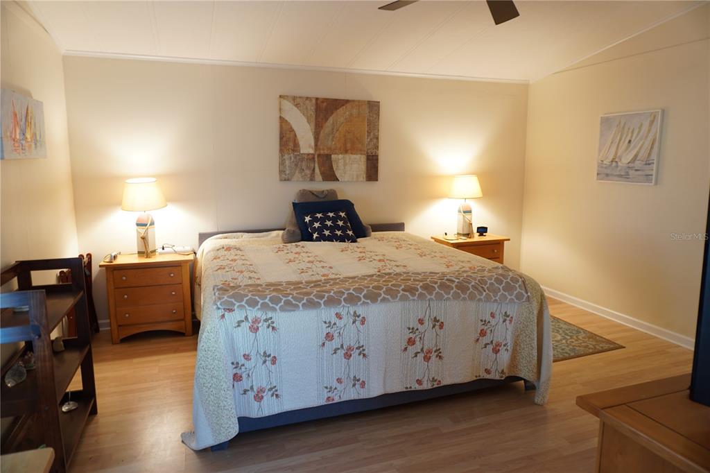 145 Rarotonga Road North Port, FL 34287 - Photo 19 of 64 a bedroom with a bed and a night stand