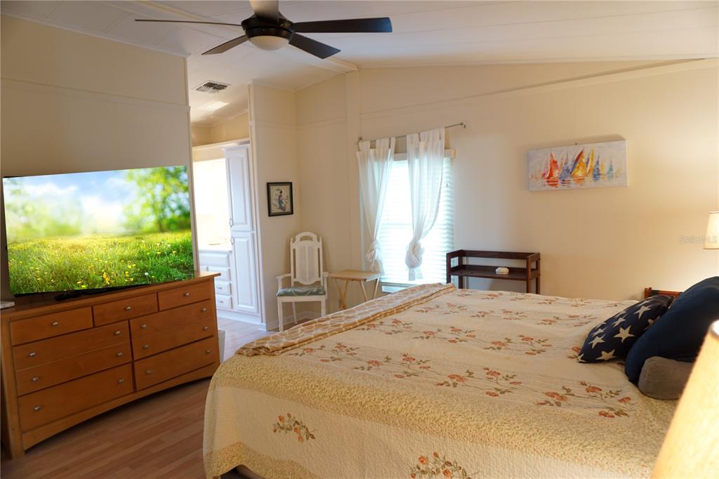 145 Rarotonga Road North Port, FL 34287 - Photo 20 of 64 a bed room with a bed mirror and a window
