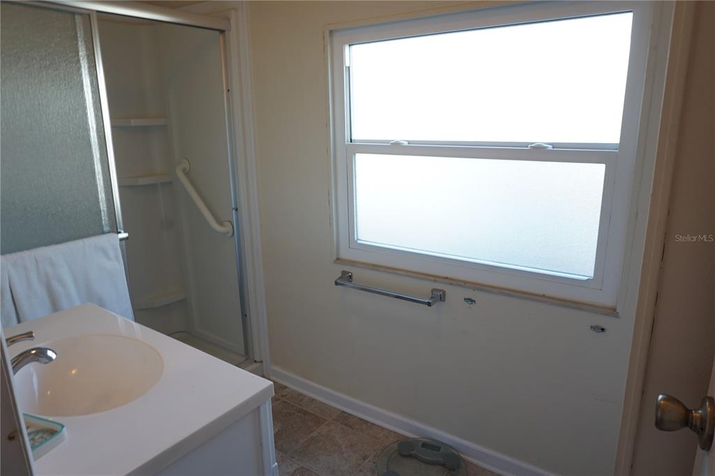 145 Rarotonga Road North Port, FL 34287 - Photo 21 of 64 a bathroom with a sink and a vanity