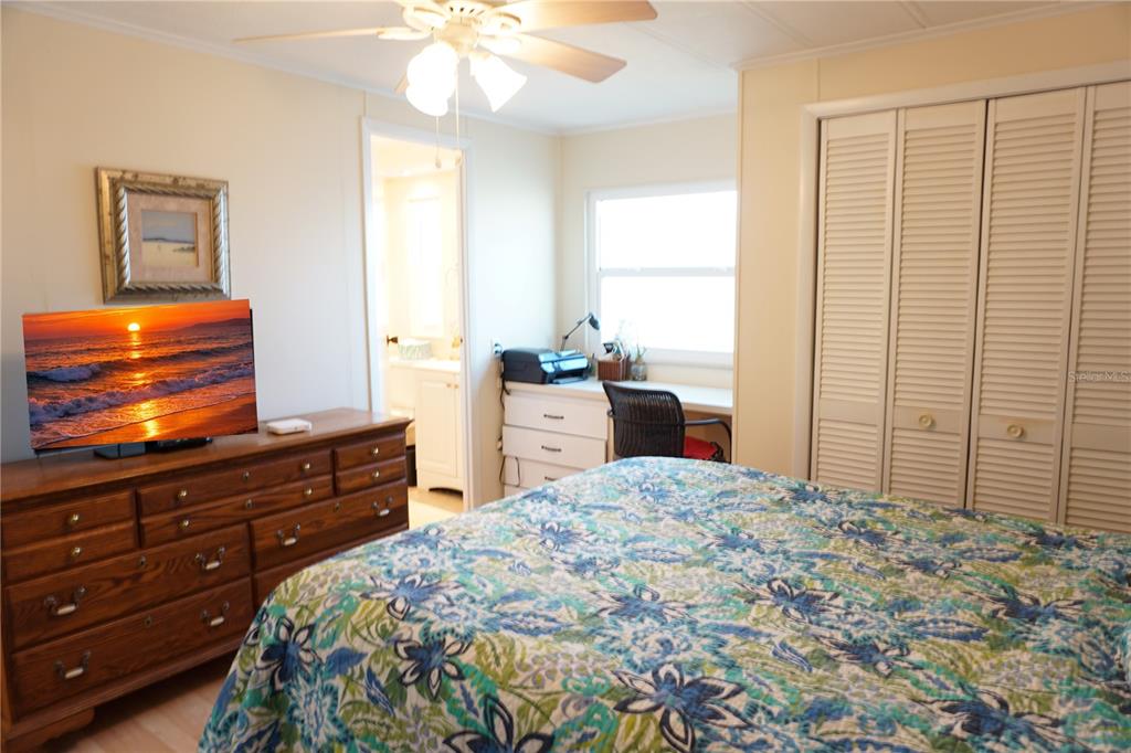 145 Rarotonga Road North Port, FL 34287 - Photo 26 of 64 a bedroom with a bed and a window