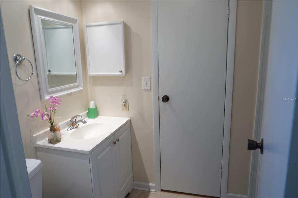 145 Rarotonga Road North Port, FL 34287 - Photo 29 of 64 a bathroom with a sink and a mirror