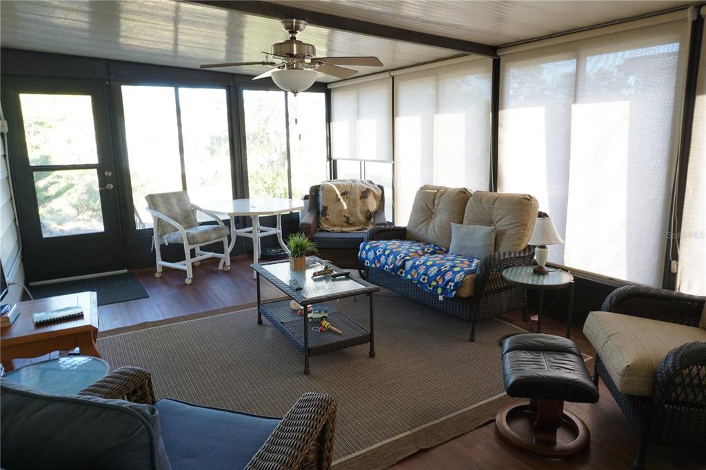 145 Rarotonga Road North Port, FL 34287 - Photo 30 of 64 a living room with furniture and a large window