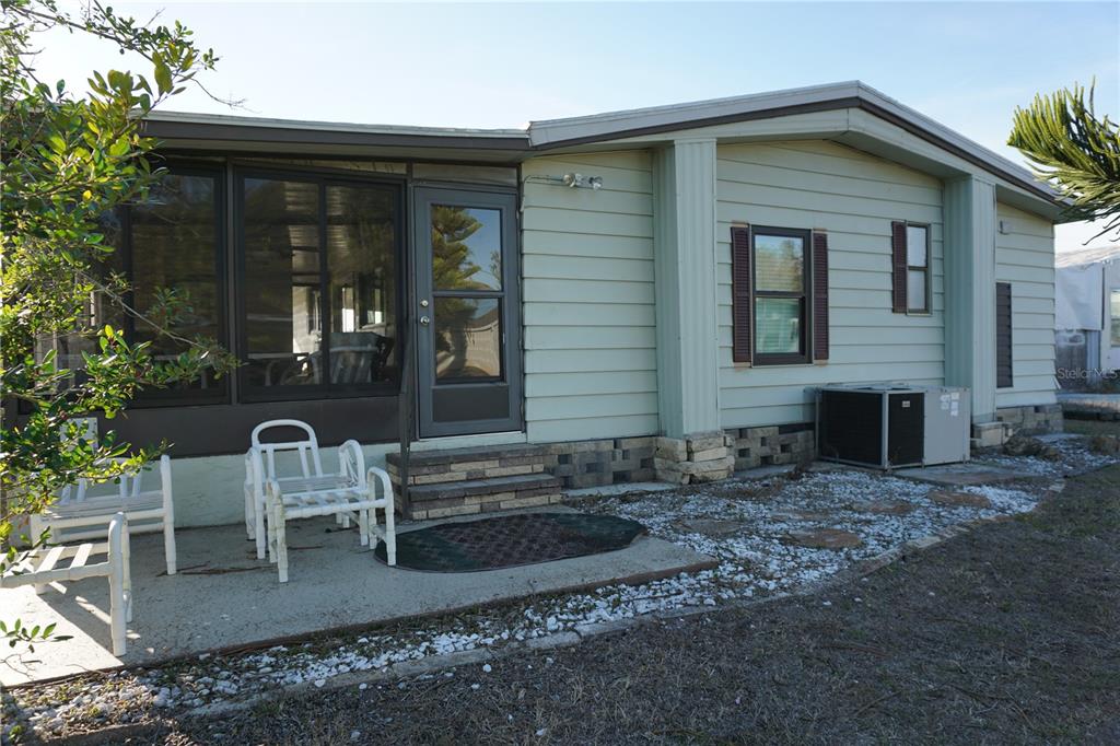 145 Rarotonga Road North Port, FL 34287 - Photo 31 of 64 a front view of house with outdoor seating