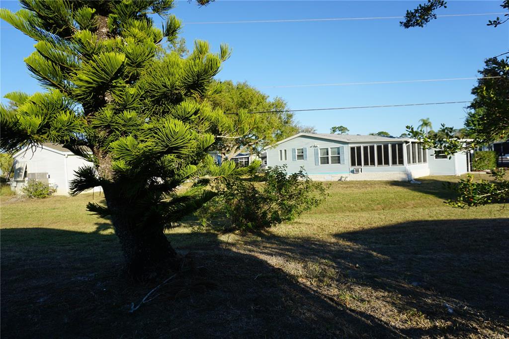 145 Rarotonga Road North Port, FL 34287 - Photo 33 of 64 a view of a house with a yard