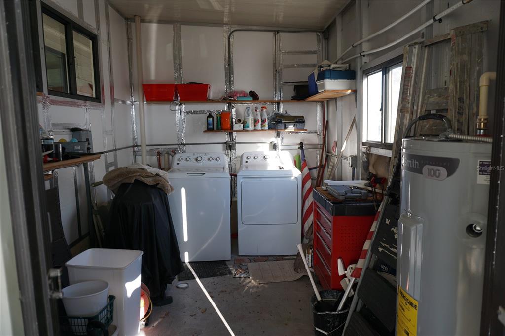 145 Rarotonga Road North Port, FL 34287 - Photo 35 of 64 a utility room with dryer and washer