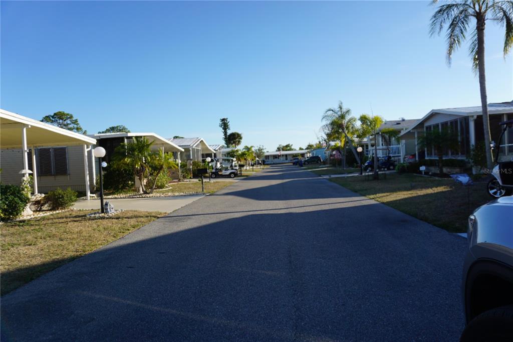 145 Rarotonga Road North Port, FL 34287 - Photo 37 of 64 a view of a house with a yard and tree s
