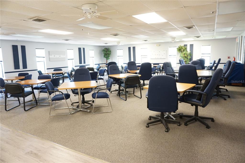 145 Rarotonga Road North Port, FL 34287 - Photo 48 of 64 a living room with lots of furniture a rug appliances and a window