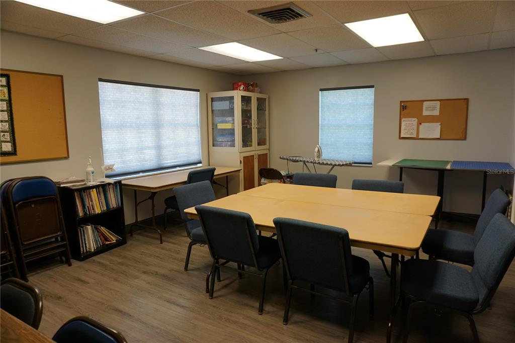 145 Rarotonga Road North Port, FL 34287 - Photo 54 of 64 a view of a a dining room with furniture window and wooden floor