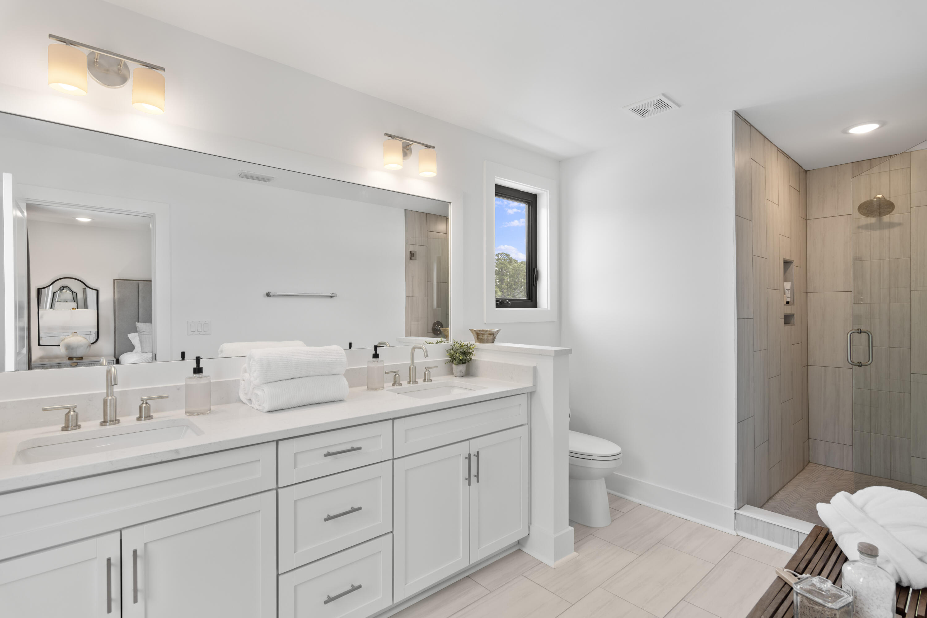 50 Blue Eden Loop, Unit LOT 39 Santa Rosa Beach, FL 32459 - Photo 17 of 29 a spacious bathroom with a double vanity sink toilet mirror and shower