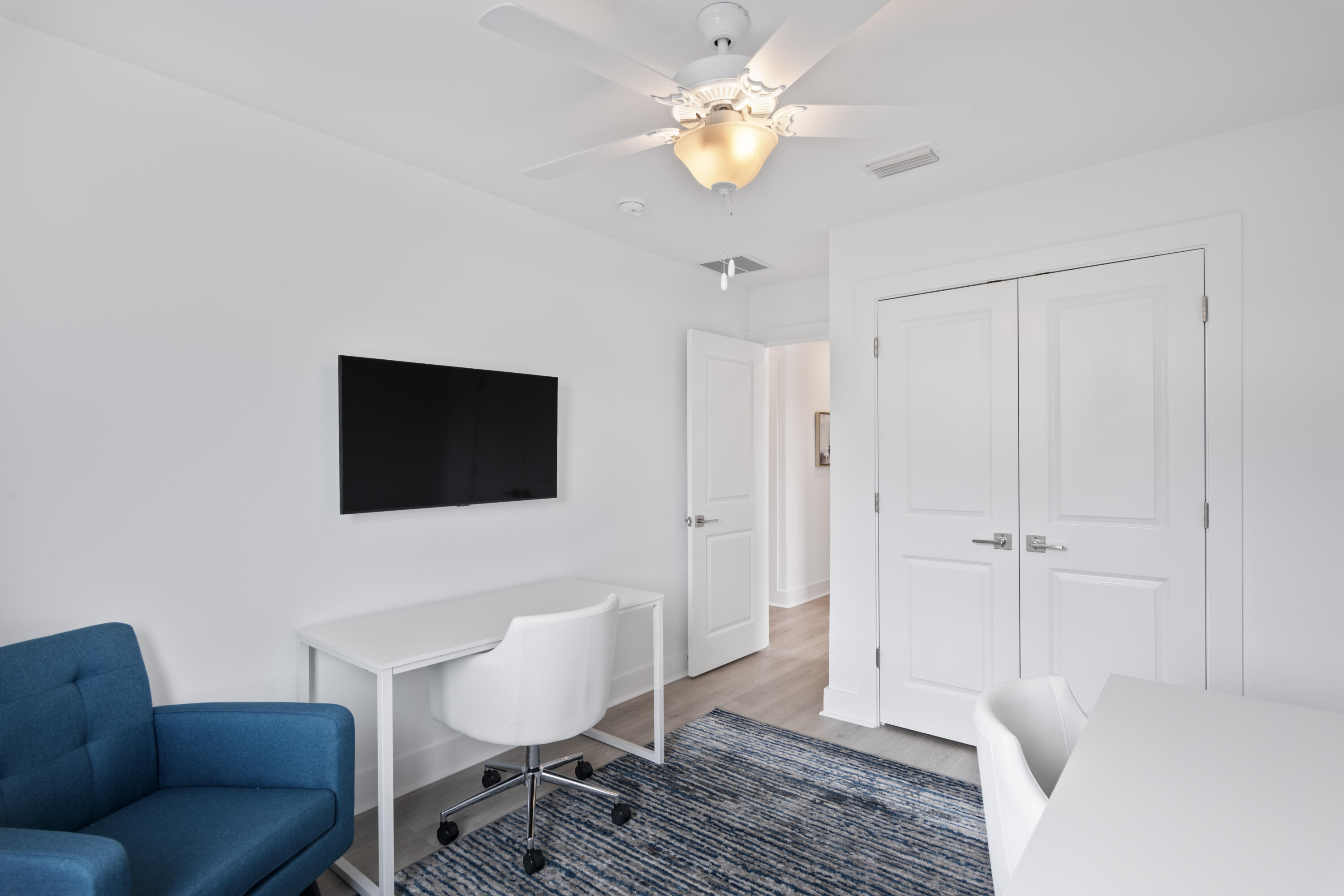 50 Blue Eden Loop, Unit LOT 39 Santa Rosa Beach, FL 32459 - Photo 21 of 29 a living room with furniture and a flat screen tv