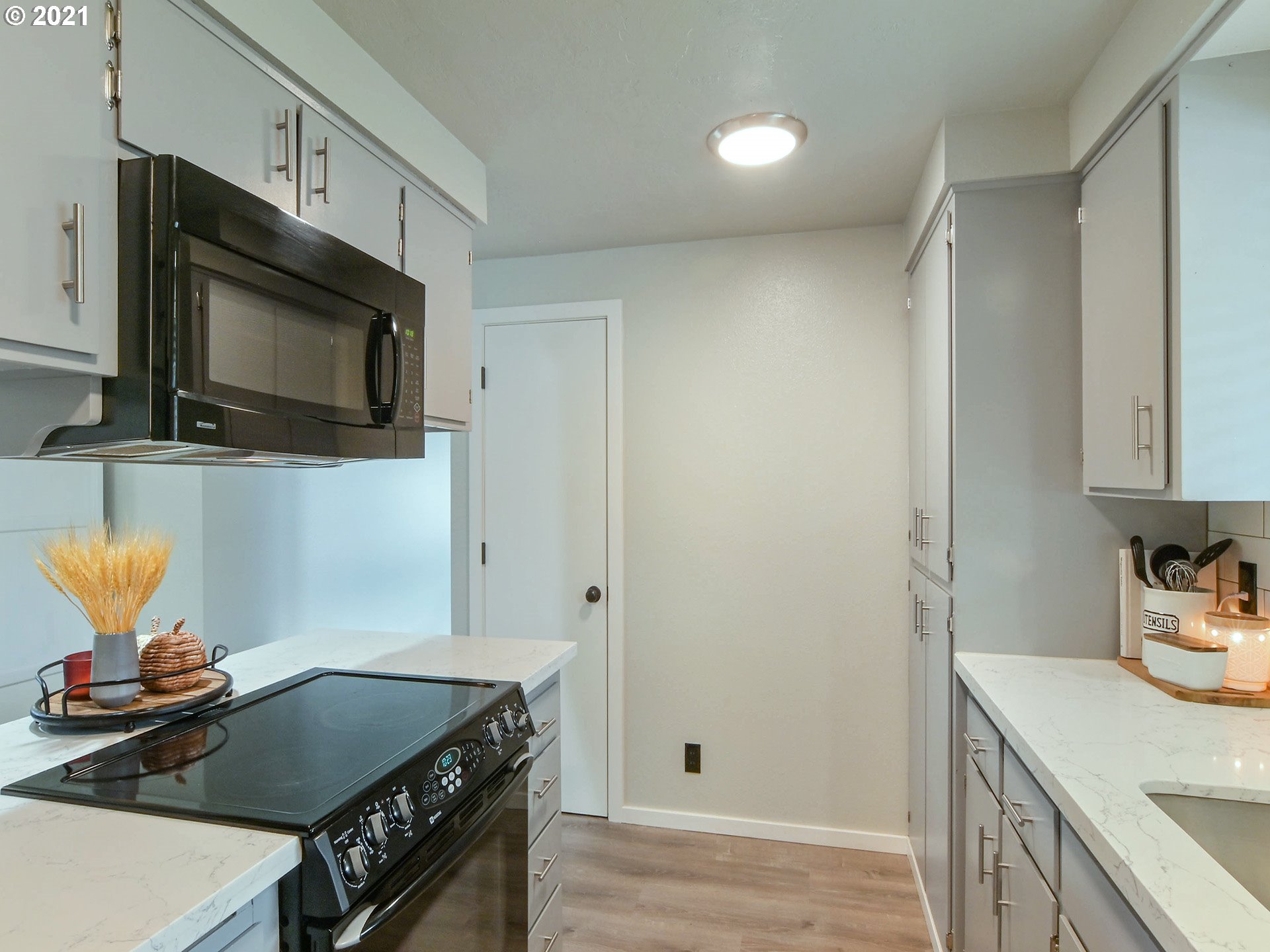 7120 B Street Springfield, OR 97478 - Photo 11 of 32 a kitchen with stainless steel appliances a stove and a microwave