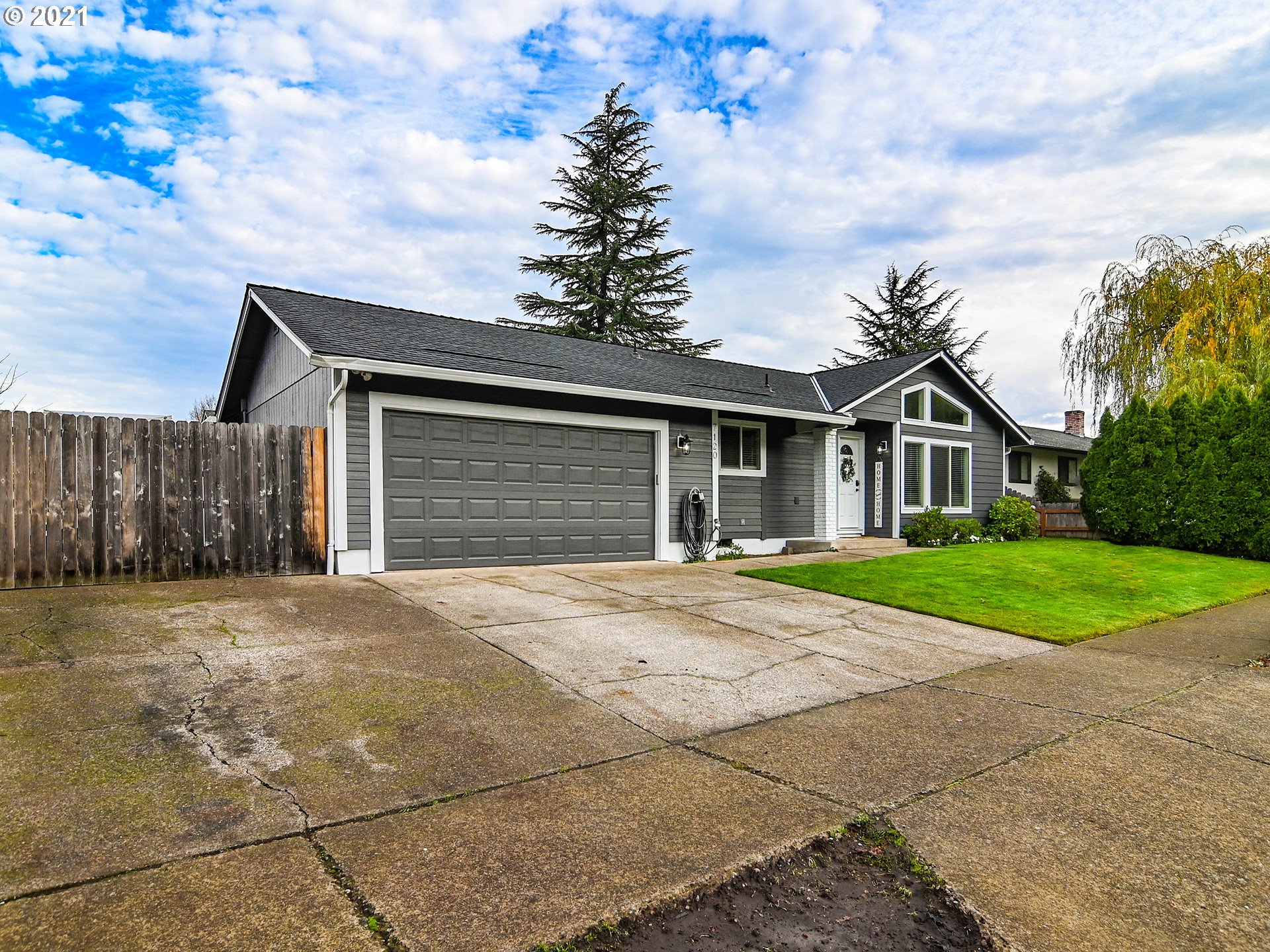 7120 B Street Springfield, OR 97478 - Photo 3 of 32 a front view of house with yard and green space