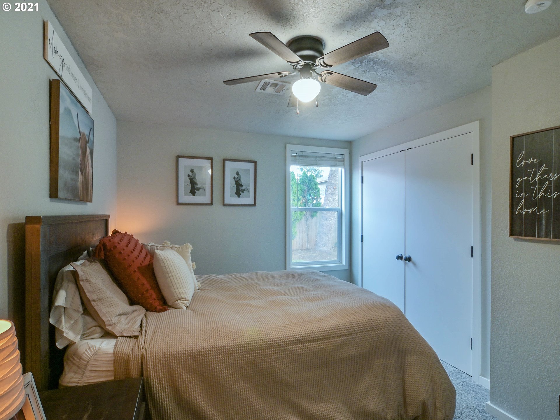 7120 B Street Springfield, OR 97478 - Photo 22 of 32 a bedroom with a bed and a chandelier
