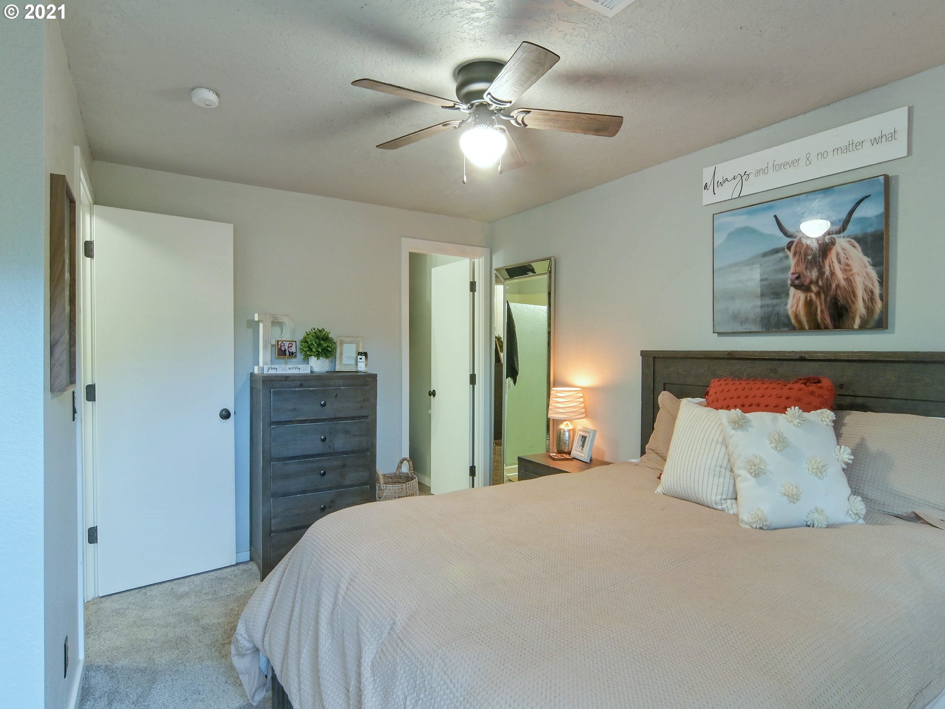 7120 B Street Springfield, OR 97478 - Photo 23 of 32 a bedroom with a bed and a painting on the wall