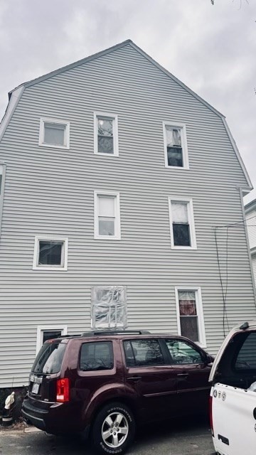 258-260 Orange Street Springfield, MA 01108 - Photo 3 of 16 a front view of a house with parking space