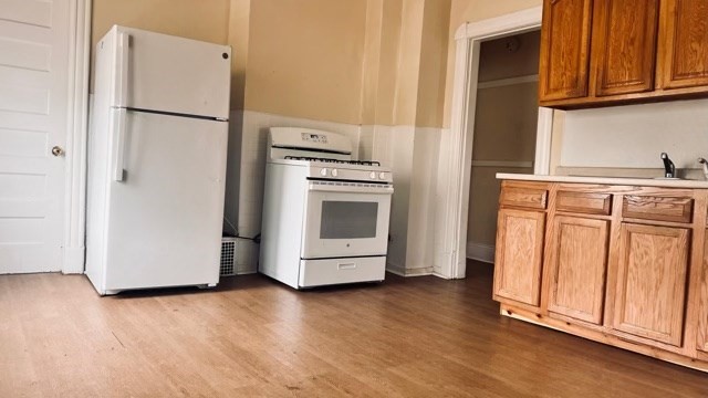 258-260 Orange Street Springfield, MA 01108 - Photo 10 of 16 a kitchen with granite countertop white cabinets and stainless steel appliances