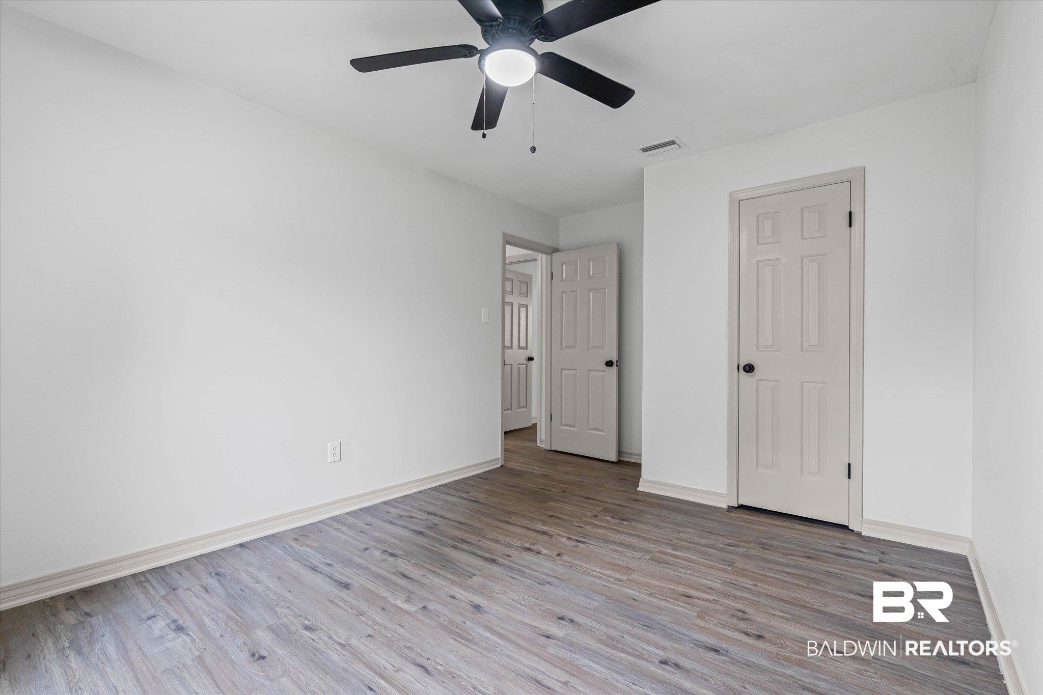 3655 Claridge Road South Mobile, AL 36608 - Photo 20 of 32 Unfurnished bedroom featuring light wood-style floors, a ceiling fan, and a closet