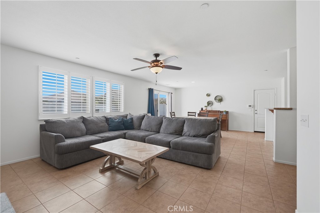 3439 Joshua Tree Court Perris, CA 92570 - Photo 18 of 49 a living room with furniture and a large window