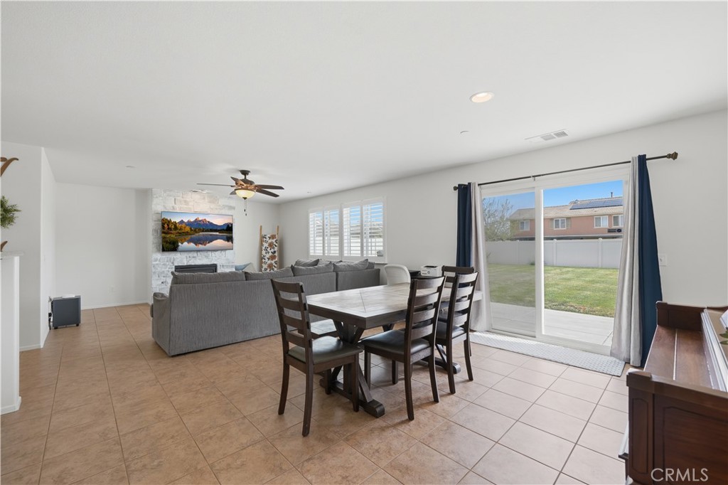 3439 Joshua Tree Court Perris, CA 92570 - Photo 22 of 49 a view of a dining room with furniture window and outside view