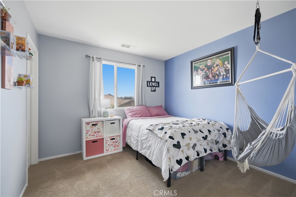 3439 Joshua Tree Court Perris, CA 92570 - Photo 39 of 49 a bedroom with a bed and a window