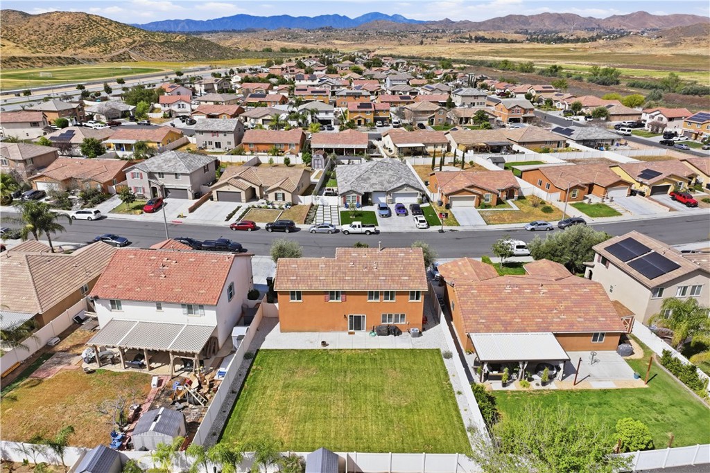 3439 Joshua Tree Court Perris, CA 92570 - Photo 7 of 49 an aerial view of residential houses with outdoor space
