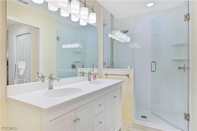 a bathroom with a sink vanity and a mirror