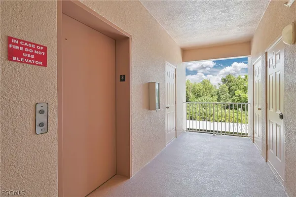a view of a city from a hallway