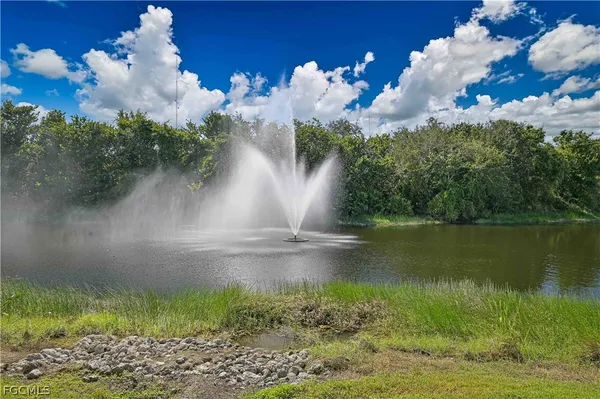 a view of a lake with a yard
