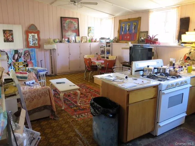 a view of kitchen and dining room with wooden floor
