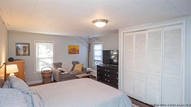 a bedroom with two beds and painted walls