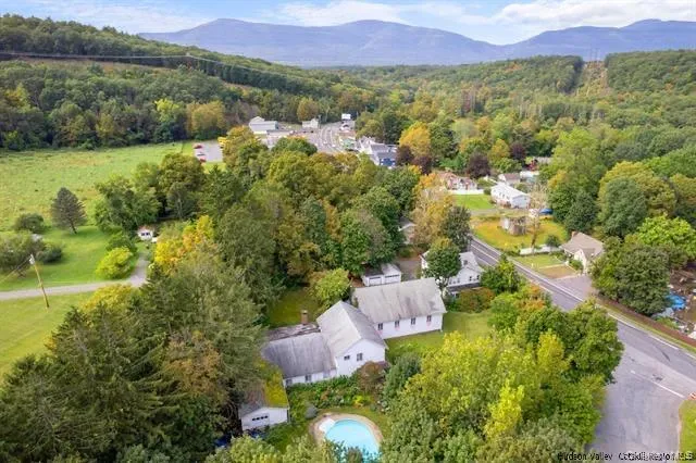 an aerial view of residential house with outdoor space and river