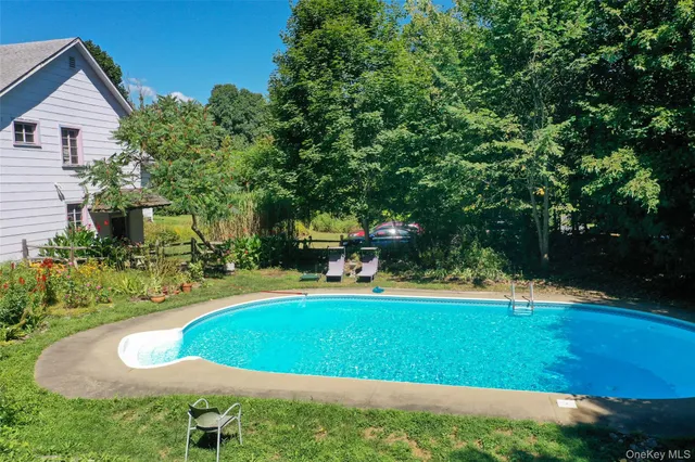 a view of a swimming pool with an outdoor space