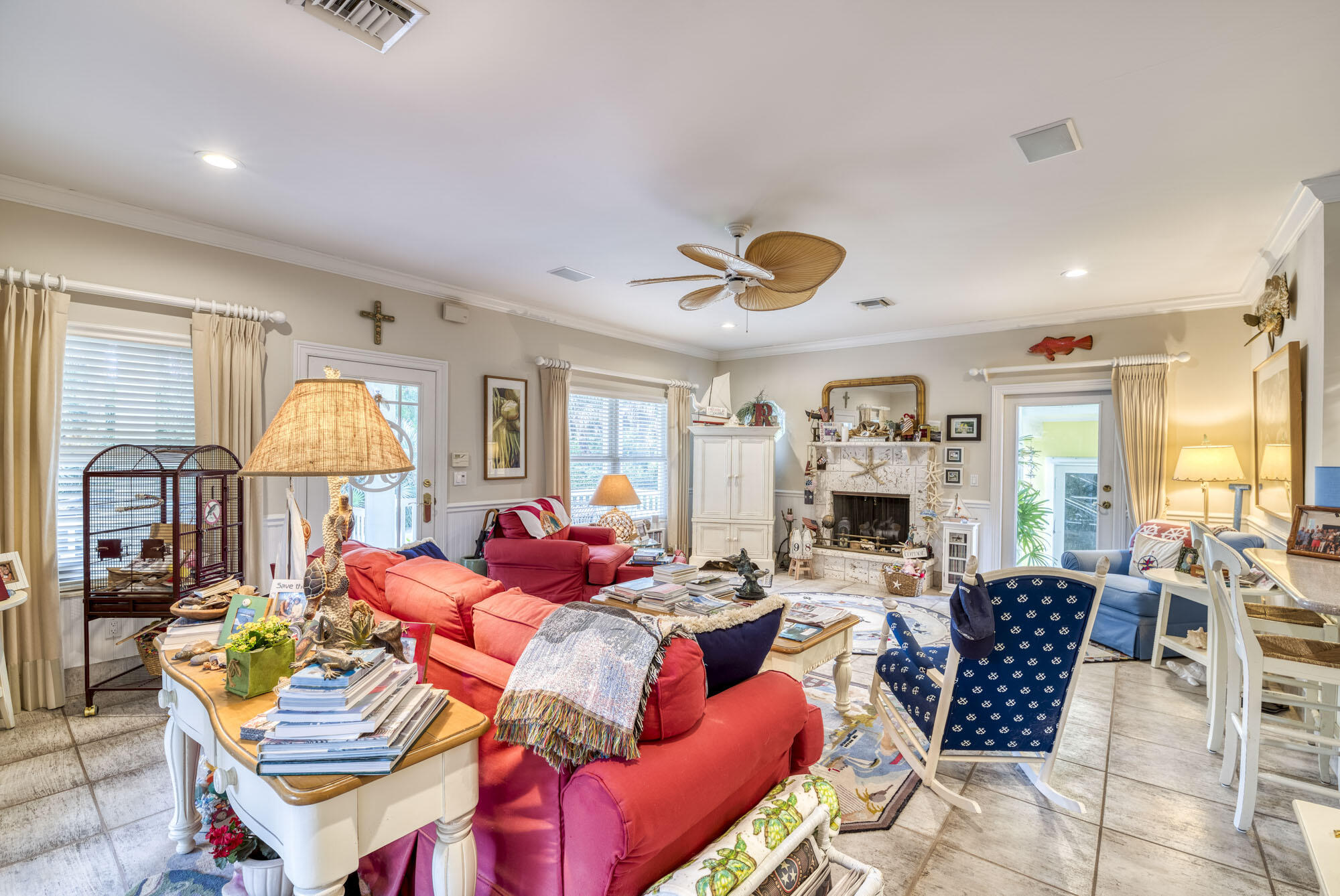 2267 Windsor Road Palm Beach Gardens, FL 33410 - Photo 16 of 45 a living room with fireplace furniture and a large window