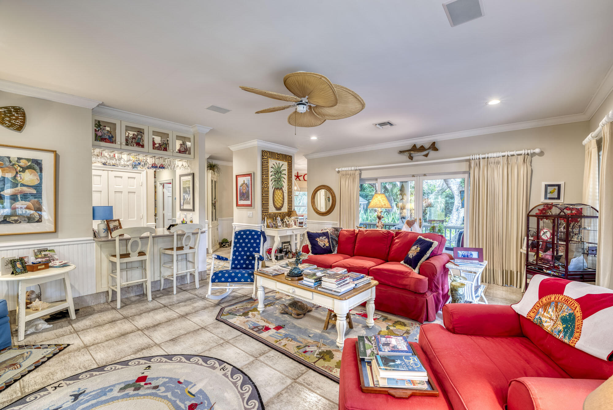 2267 Windsor Road Palm Beach Gardens, FL 33410 - Photo 17 of 45 a living room with furniture a rug and a chandelier