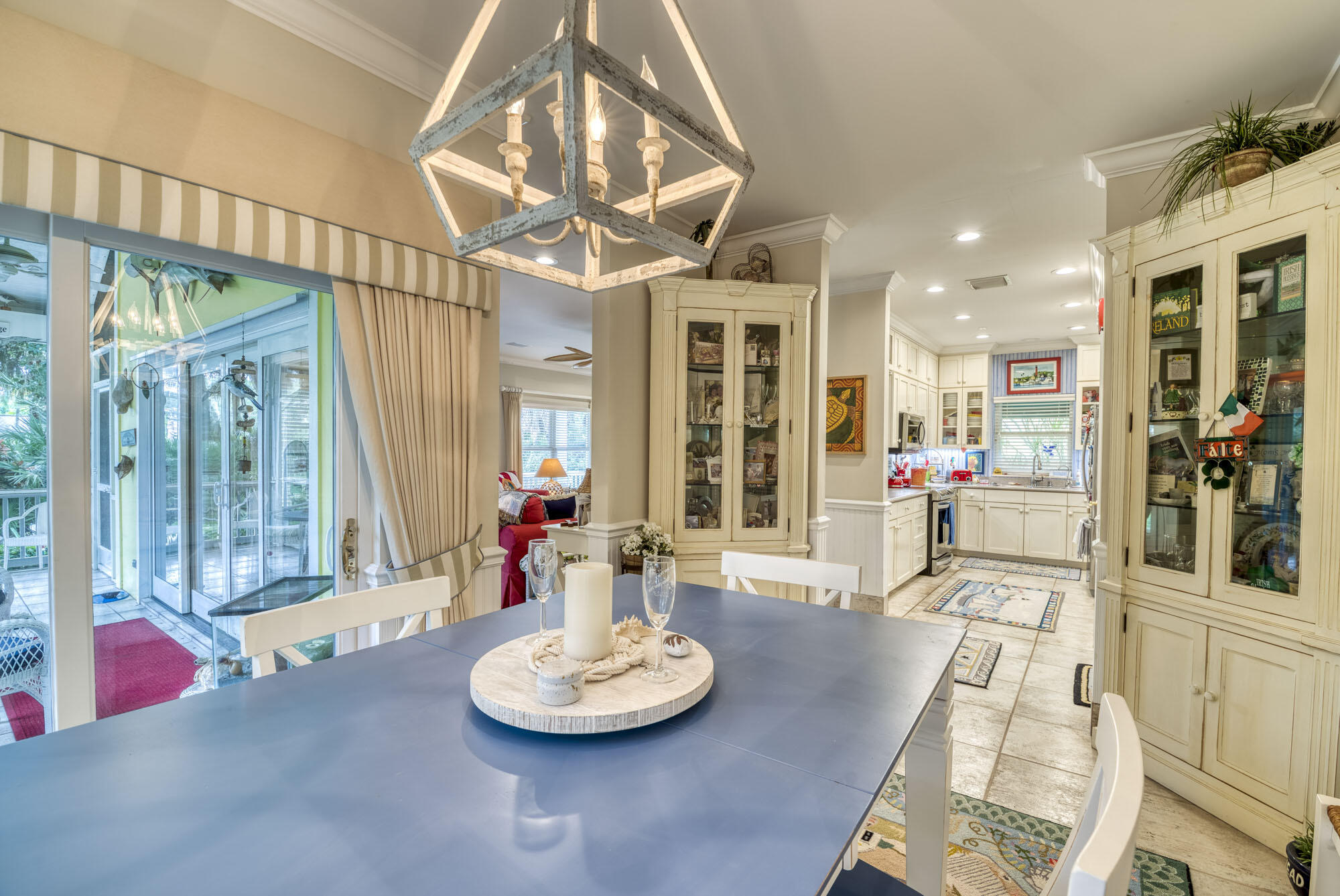 2267 Windsor Road Palm Beach Gardens, FL 33410 - Photo 19 of 45 a living room with furniture and a dining table with garden view