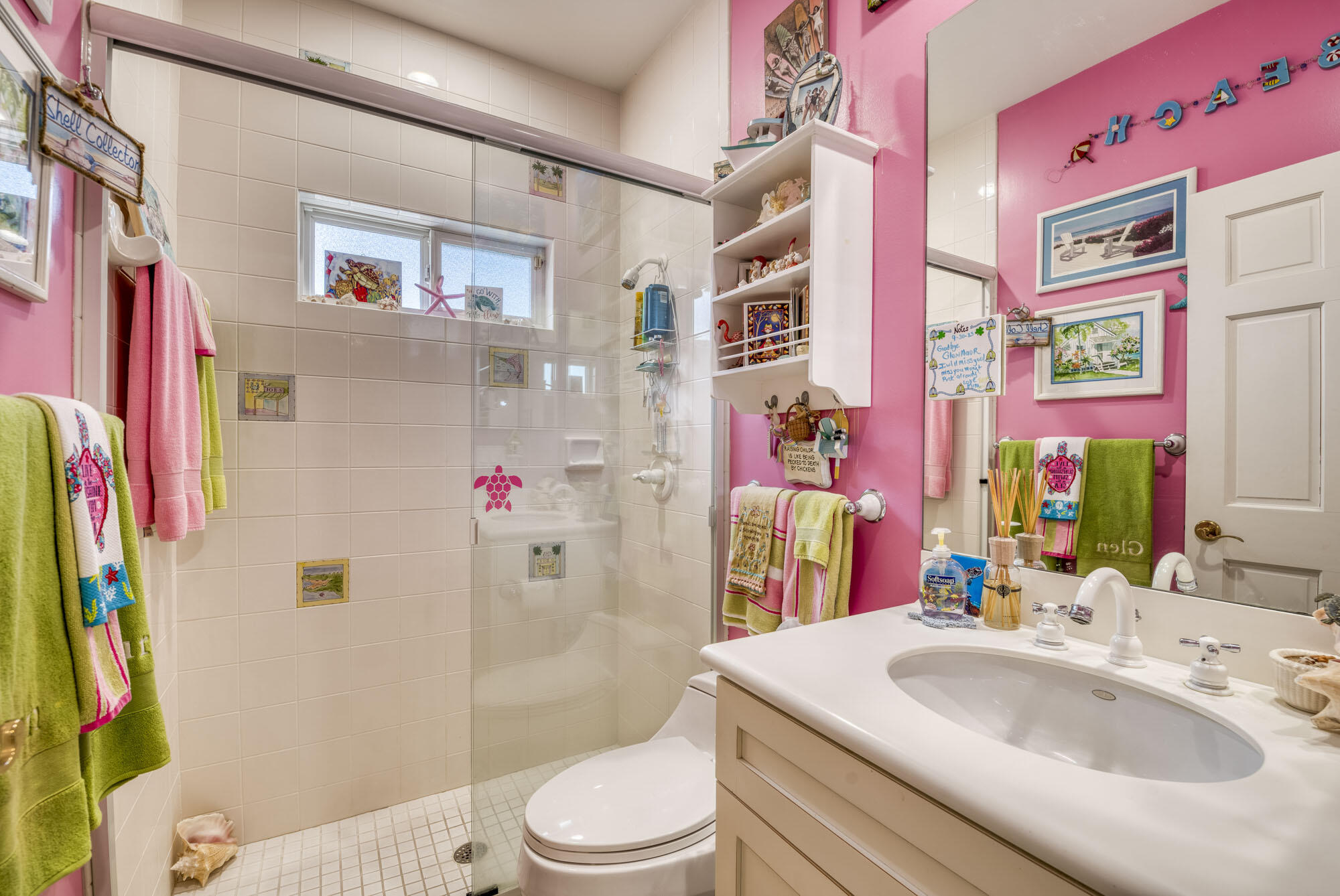 2267 Windsor Road Palm Beach Gardens, FL 33410 - Photo 25 of 45 a bathroom with a sink toilet and a mirror