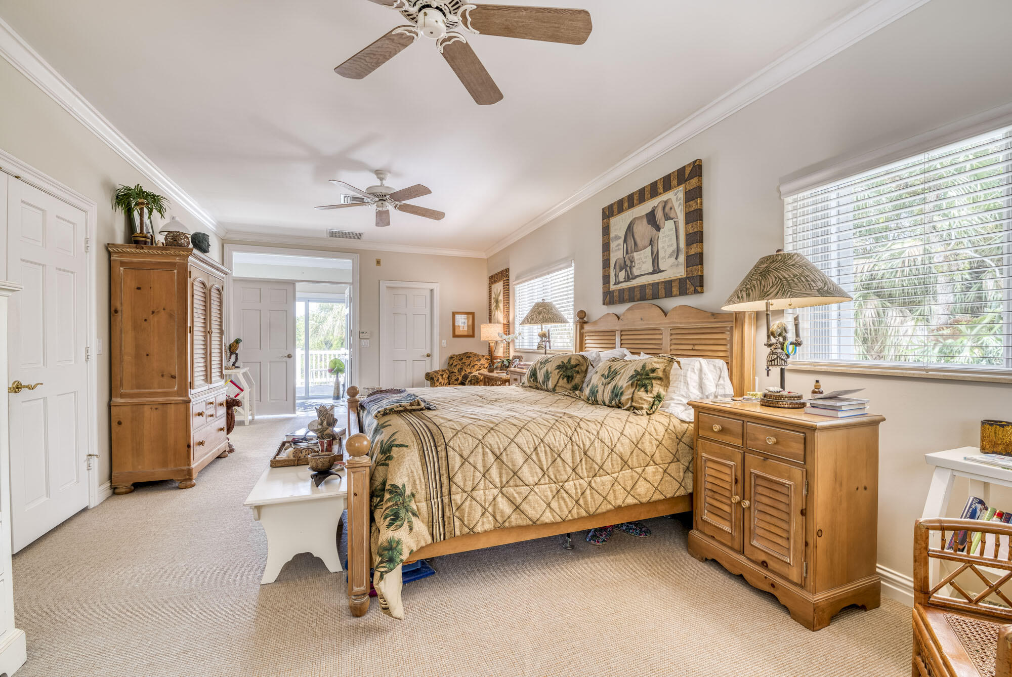 2267 Windsor Road Palm Beach Gardens, FL 33410 - Photo 28 of 45 a bedroom with a bed and a chandelier