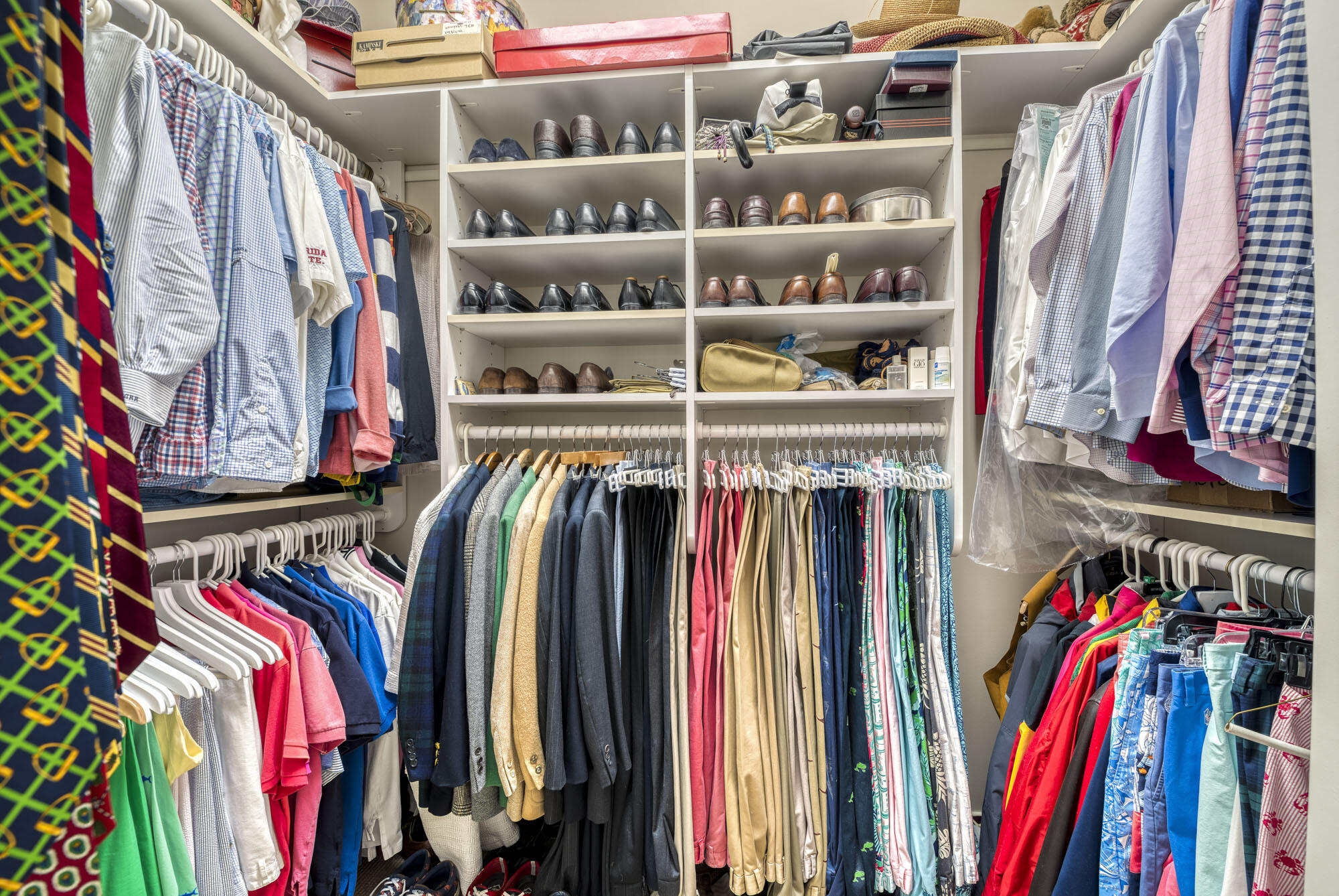 2267 Windsor Road Palm Beach Gardens, FL 33410 - Photo 29 of 45 a view of walk in closet with clothes and shoes