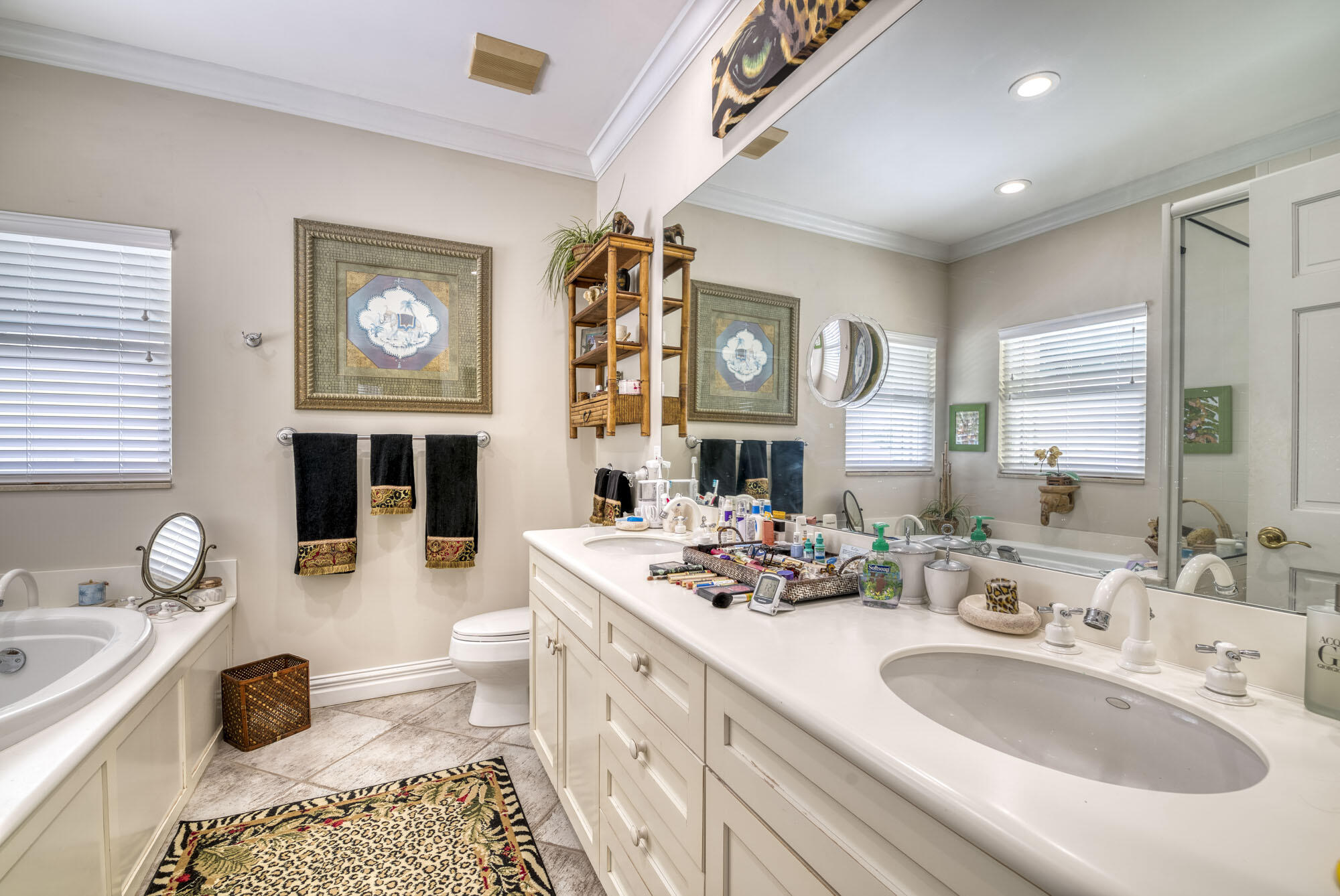 2267 Windsor Road Palm Beach Gardens, FL 33410 - Photo 30 of 45 a bathroom with a sink a toilet and a mirror