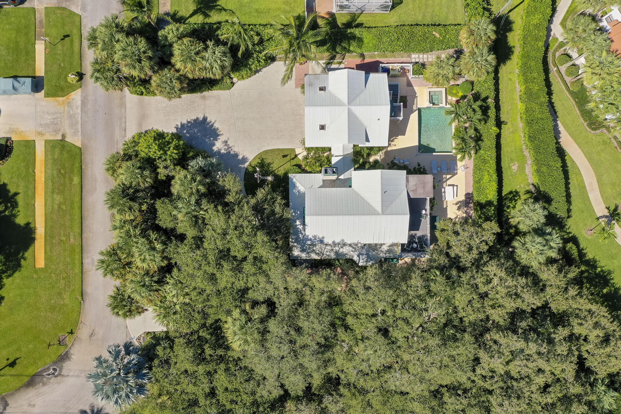 2267 Windsor Road Palm Beach Gardens, FL 33410 - Photo 3 of 45 an aerial view of a house with a garden and trees