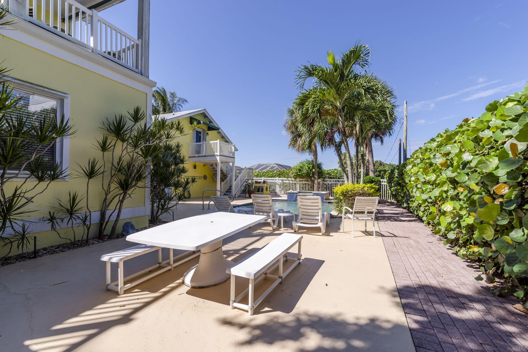 2267 Windsor Road Palm Beach Gardens, FL 33410 - Photo 35 of 45 a view of a patio with swimming pool