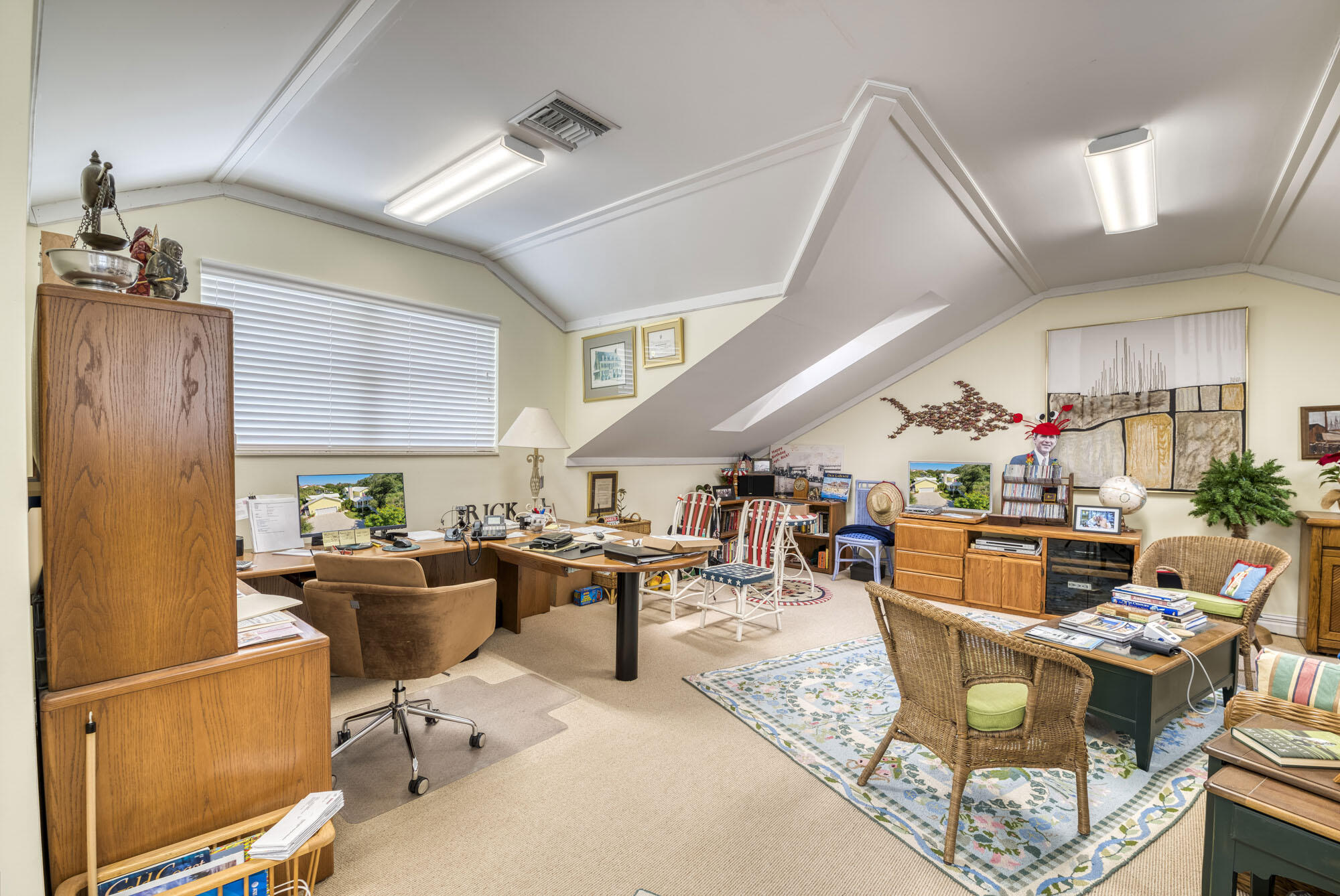 2267 Windsor Road Palm Beach Gardens, FL 33410 - Photo 38 of 45 a living room with lots of furniture and a chandelier