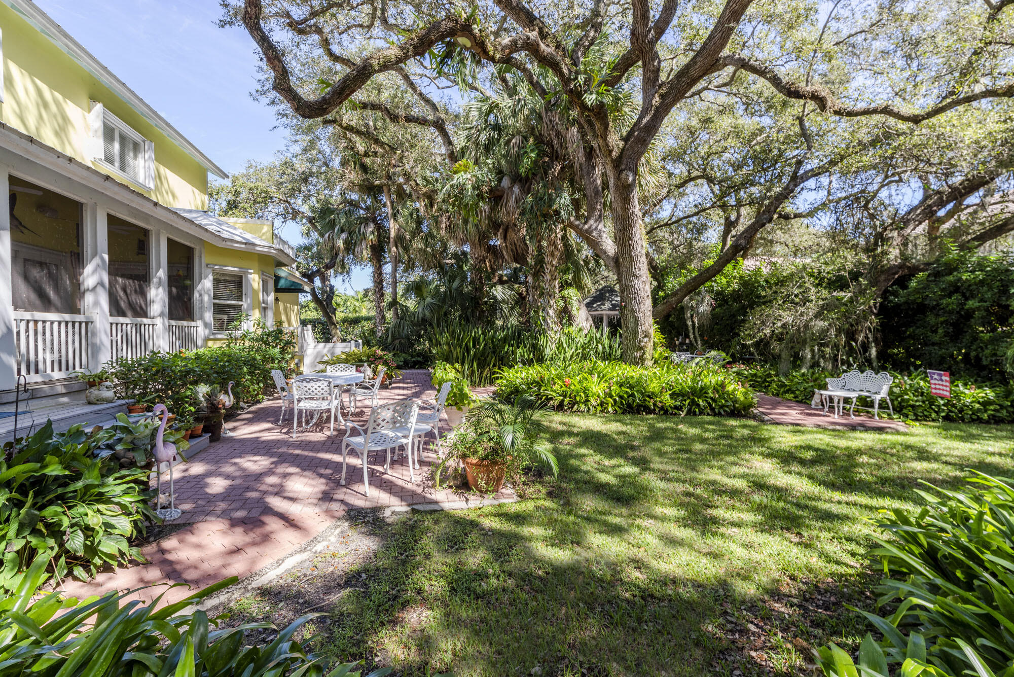 2267 Windsor Road Palm Beach Gardens, FL 33410 - Photo 8 of 45 a view of a house with a yard and sitting area