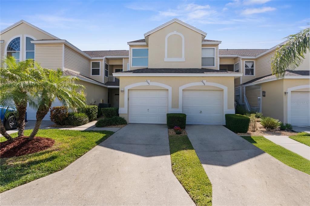 1050 Starkey Road, Unit 2205 Largo, FL 33771 - Photo 1 of 1 a front view of a house with a yard