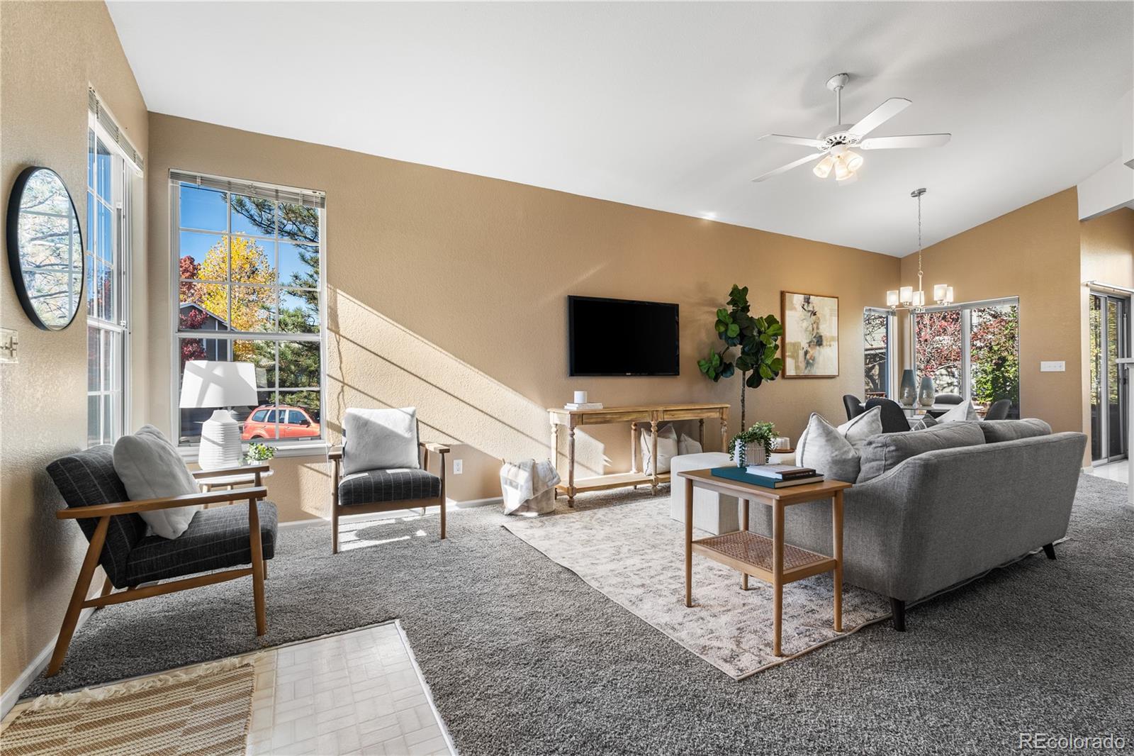 12799 East Wyoming Circle Aurora, CO 80012 - Photo 14 of 44 a living room with furniture and a flat screen tv