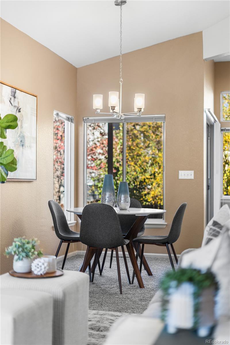 12799 East Wyoming Circle Aurora, CO 80012 - Photo 16 of 44 a view of a dining room with furniture window and outside view