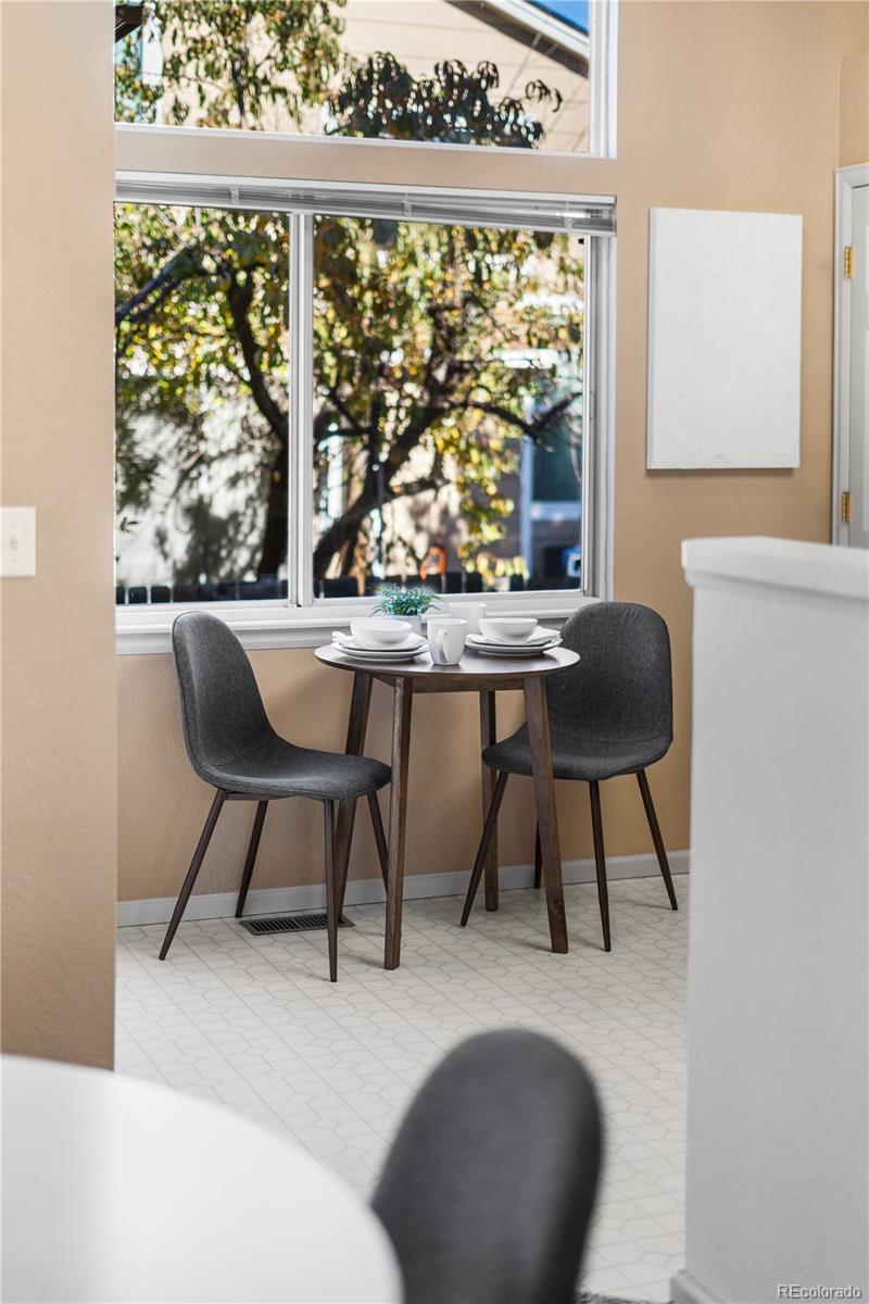 12799 East Wyoming Circle Aurora, CO 80012 - Photo 20 of 44 a dining room with furniture and window